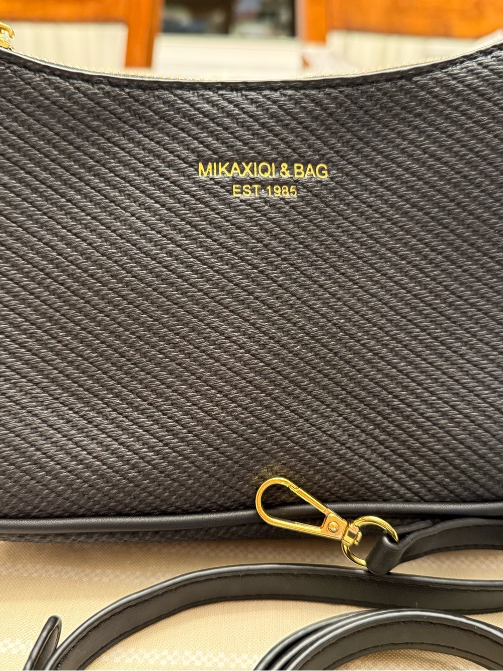 Mikaxiqi crossbody, black purse, measuring 6 x 10“
